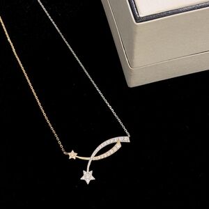 Chanel shooting star cross necklace